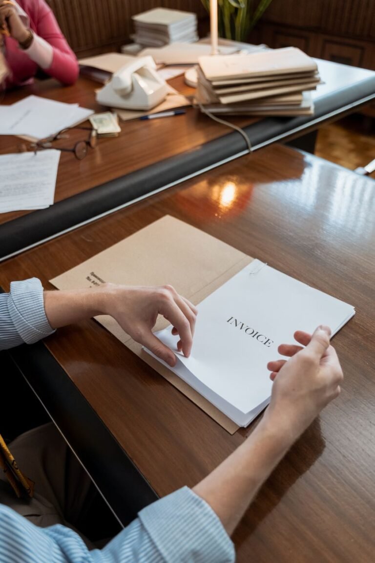 a person holding an invoice documents